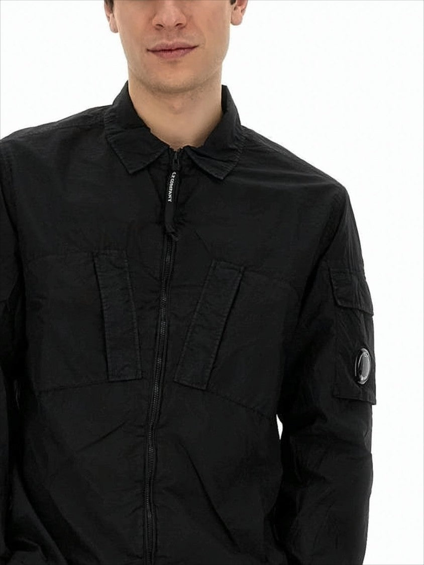 C.P. Company Minimalist Black Polyamide Jacket With Innovative Design Elements