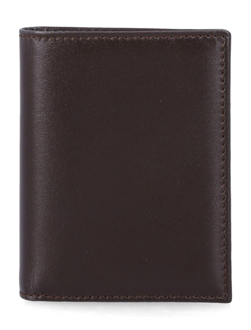 Comme Des Garçons Sleek Leather Bi-Fold Wallet With Gold Logo Accent