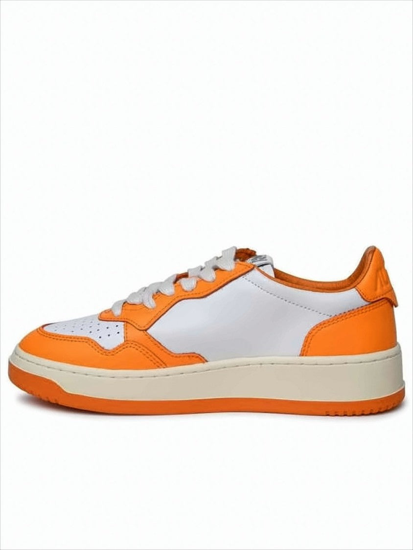 Autry Low-Top Sneakers With Vibrant Orange Overlays And Perforated Detailing