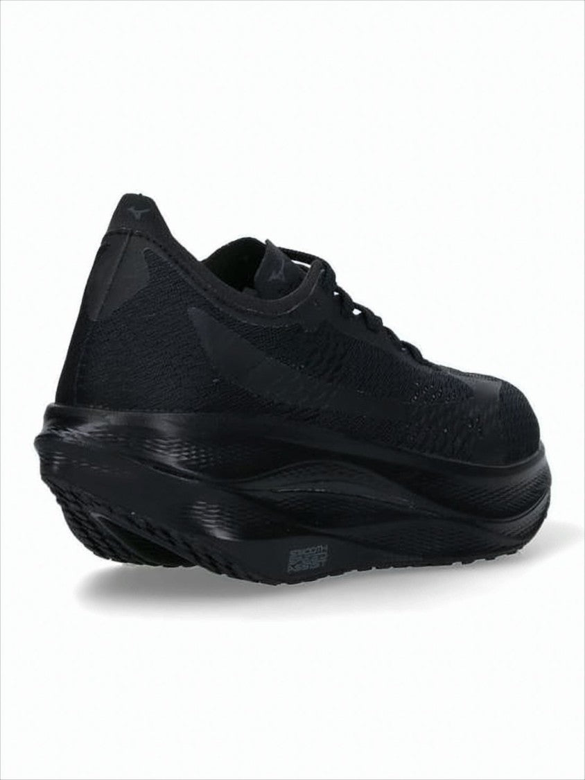 Comme Des Garçons Streamlined All-Black Sneakers With Textured Sole