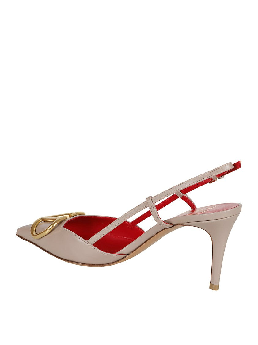 Valentino Garavani Pointed-Toe Calfskin Pumps With Gold-Tone Vlogo Plaque