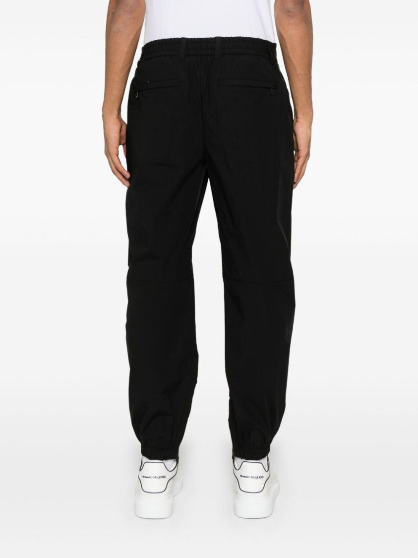 Dolce & Gabbana Black Tapered Trousers With Concealed Fastening