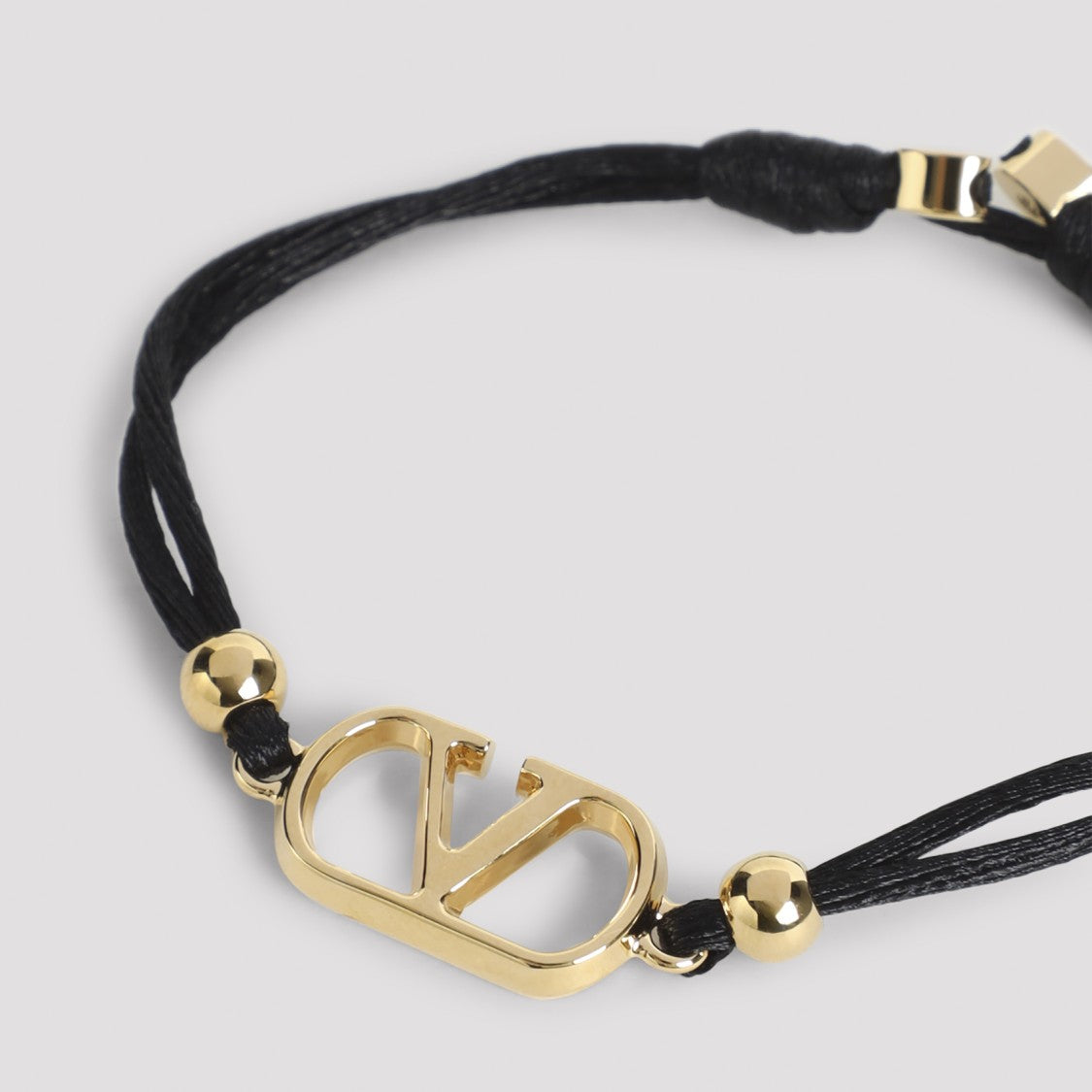 Valentino Garavani Black Cord Bracelet With Central Gold Emblem