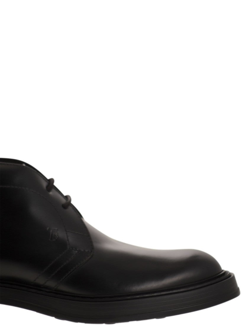 Tod's Calfskin Ankle Boots With Embossed Monogram