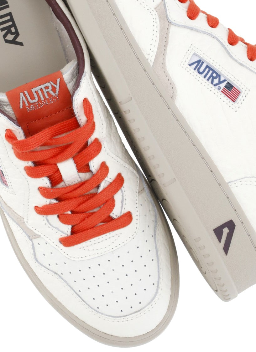 Autry White Grey Suede Orange Accents Low-Top Sneakers
