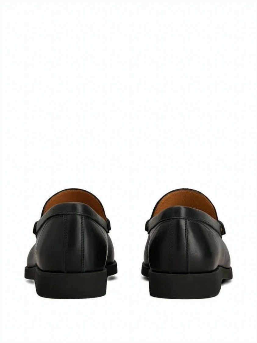 Tod's Black Leather Loafer With Classic Penny Strap And Rubber Pebbled Sole