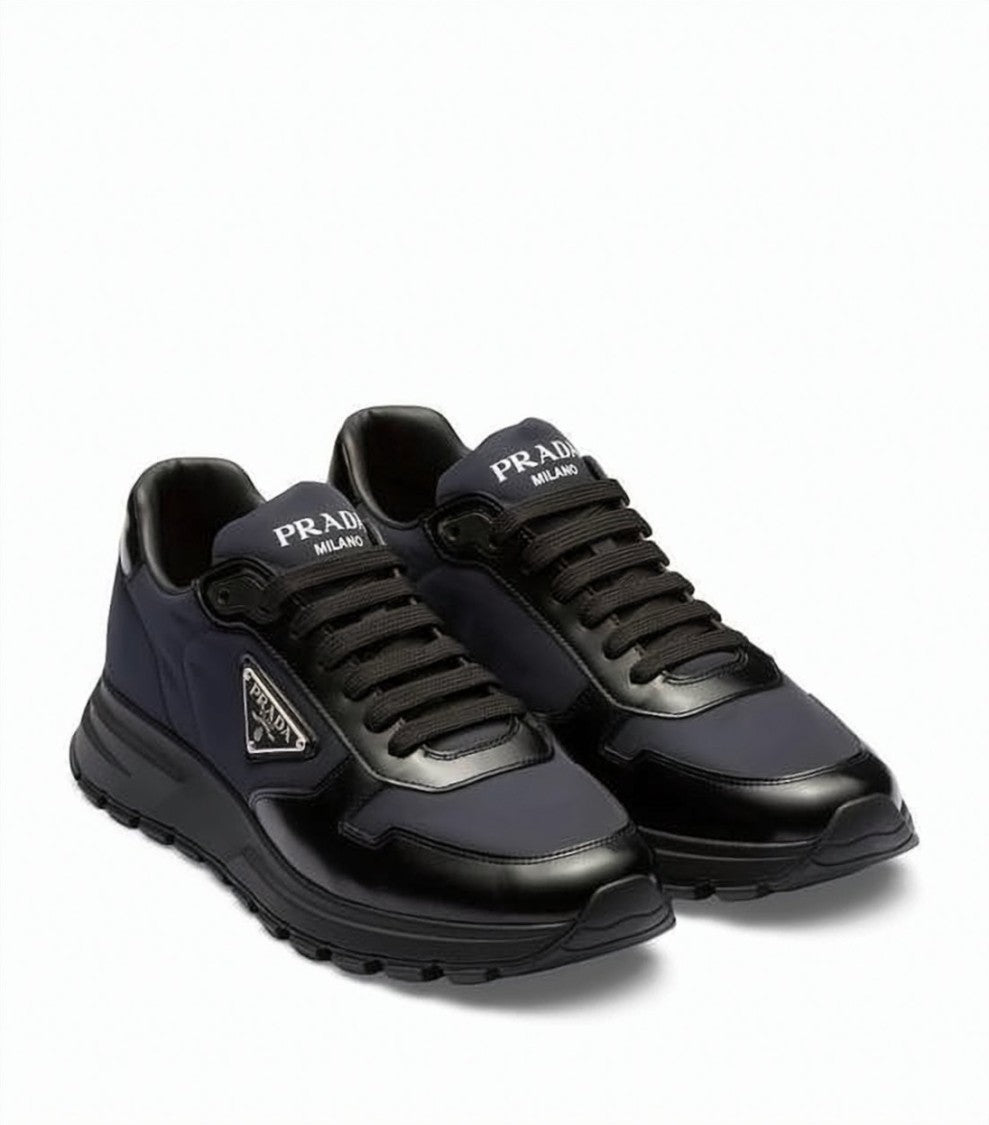 Prada Low-Top Sneakers With Glossy Leather Overlays And Triangular Logo