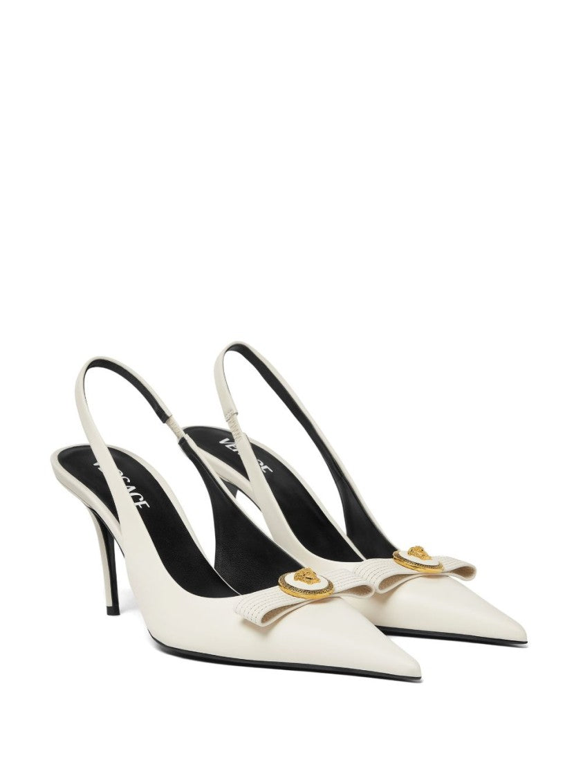 Versace Pointed Toe Slingback Heels With Textured Bow And Gold Medallion