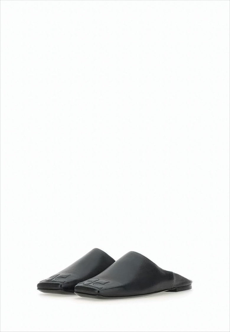 Courrèges Minimalist Black Lambskin Slip-On Mules With Embossed Detail
