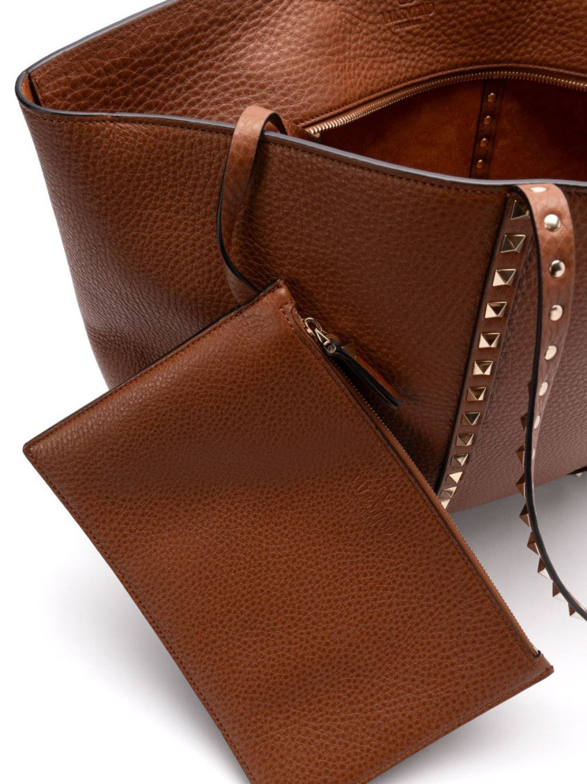 Valentino Garavani Structured Handbag With Subtle Sheen And Versatile Carrying Options