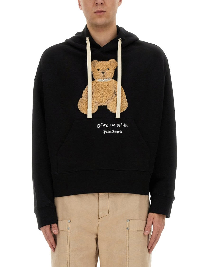 Palm Angels Cropped Black Hoodie With Teddy Bear Graphic