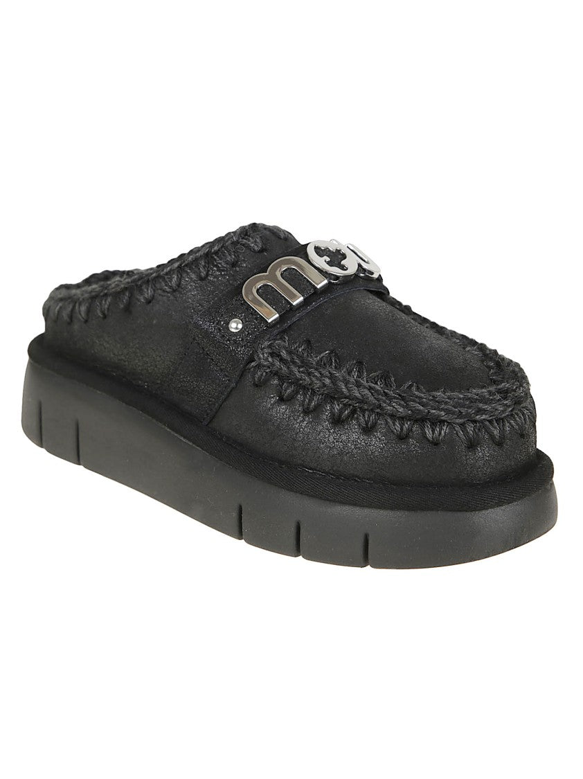 Mou Moccasin-Inspired Black Slip-On Ankle Boots With Whipstitch Detailing