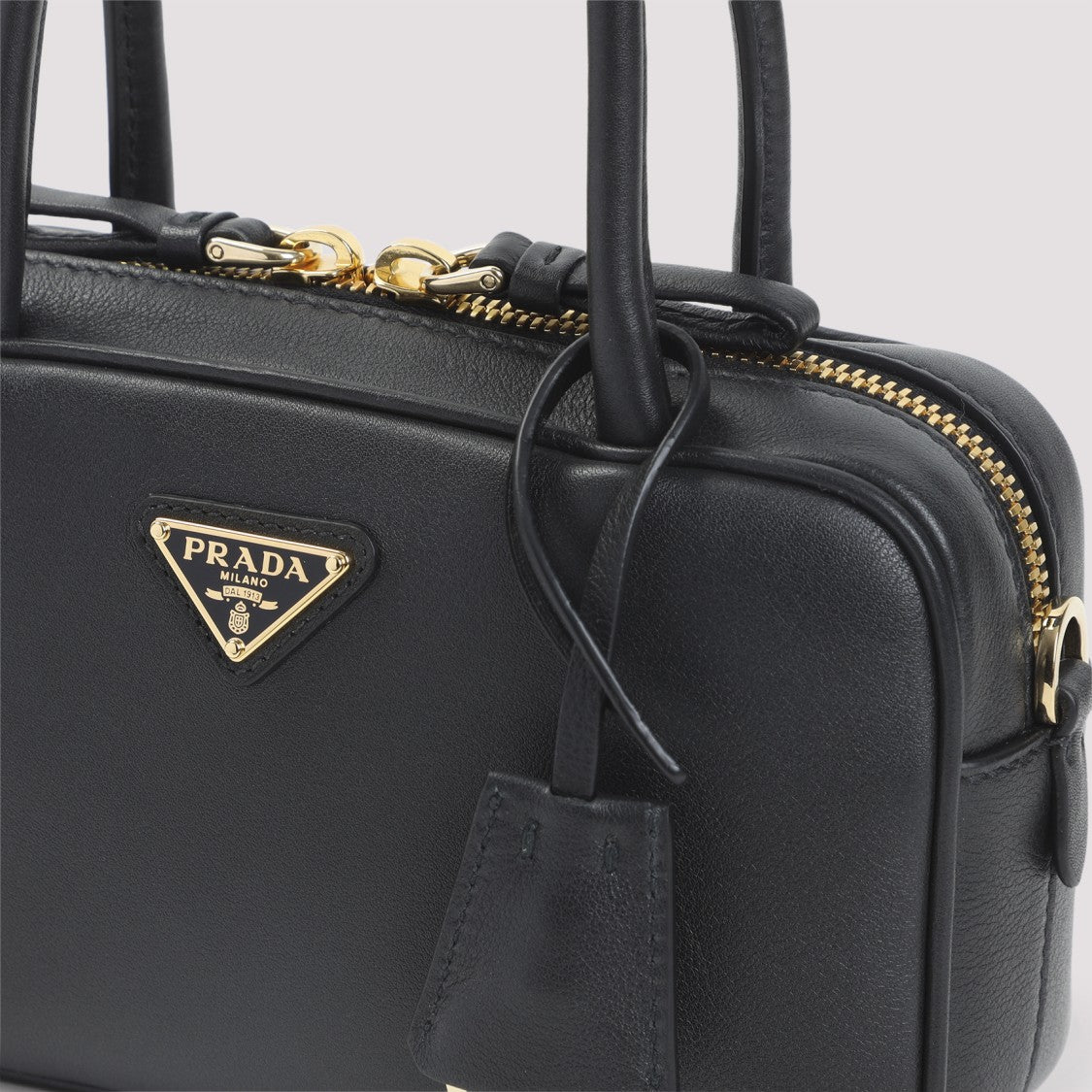 Prada Compact Black Calf Leather Handbag With Gold Accents