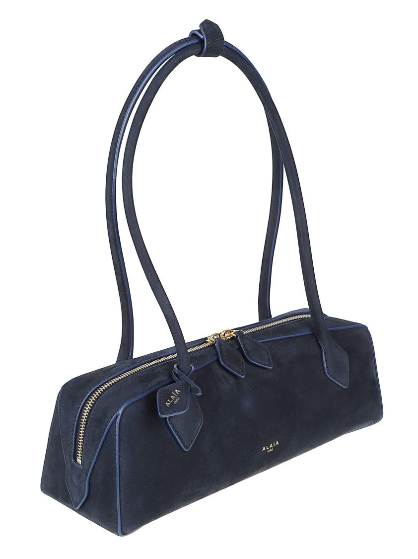 Alaïa Structured Blue Handbag With Minimalist Design And Gold Accents