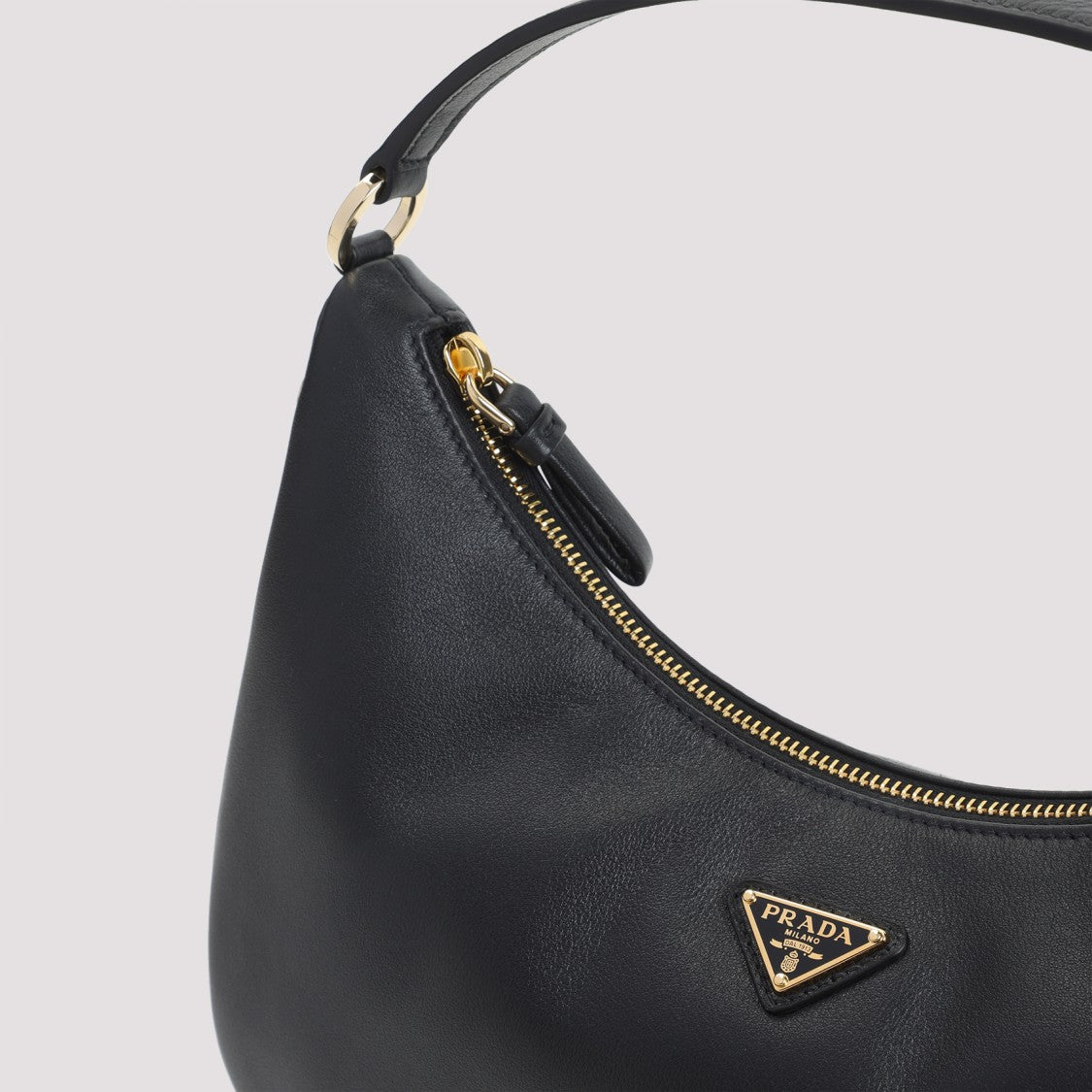 Prada Crescent-Shaped Black Calf Leather Handbag With Gold Accents