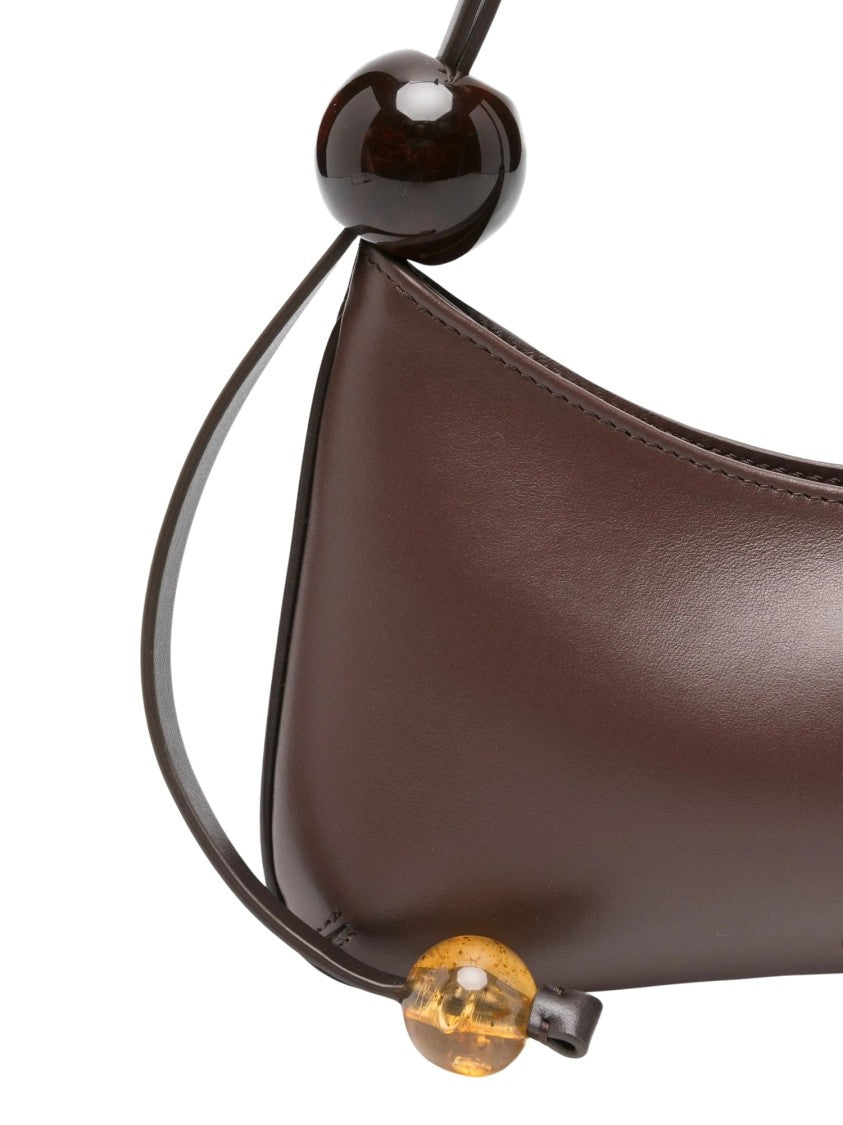 Jacquemus Sculpted Shoulder Bag With Curved Silhouette And Elegant Bead Accents