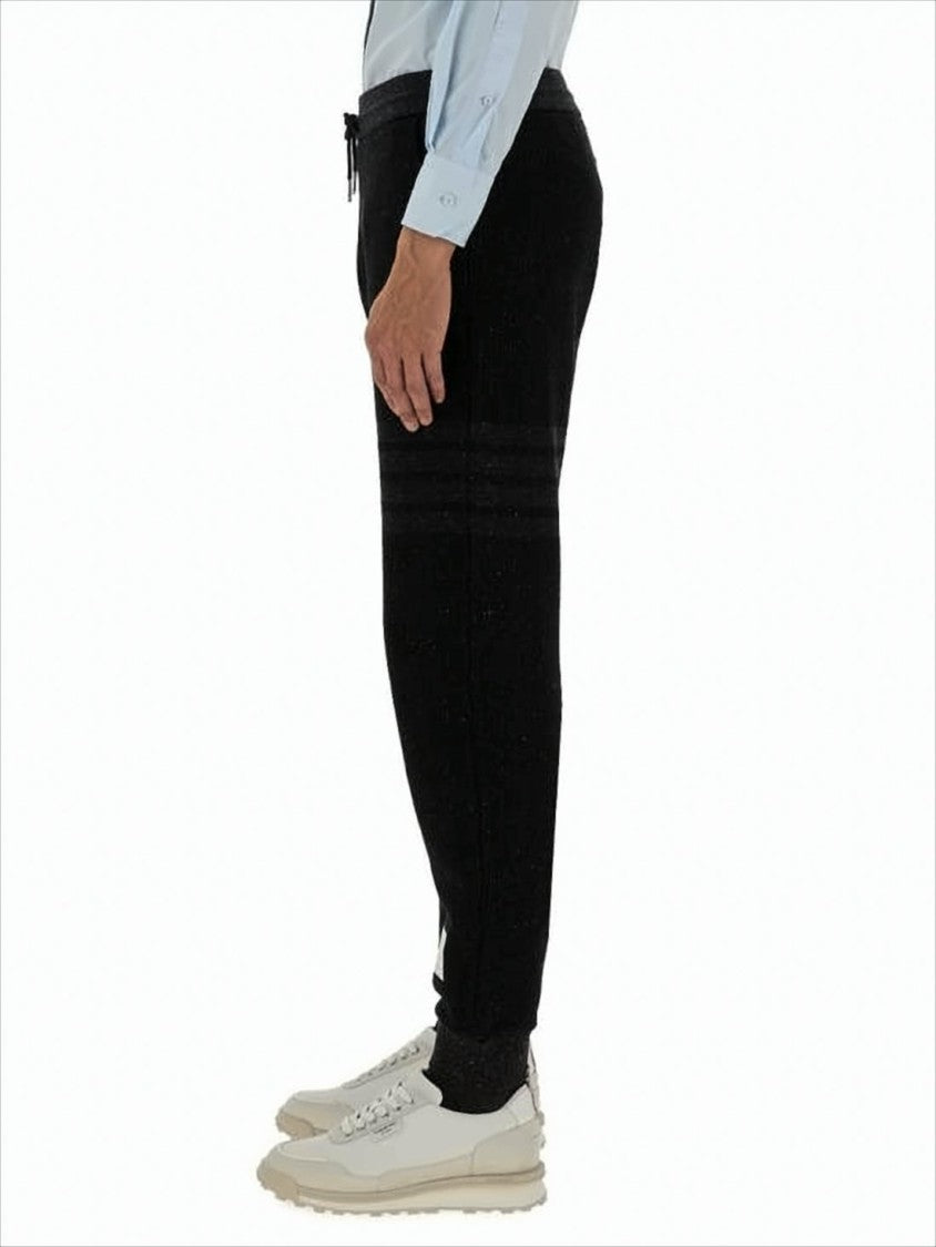 Thom Browne Tapered Jogger Pants With Ribbed Cuffs And Subtle Stripes