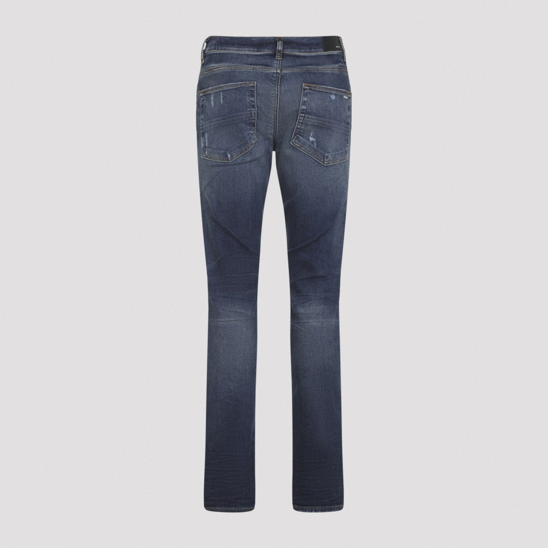 Amiri Distressed Blue Jeans With Edgy Ripped Details