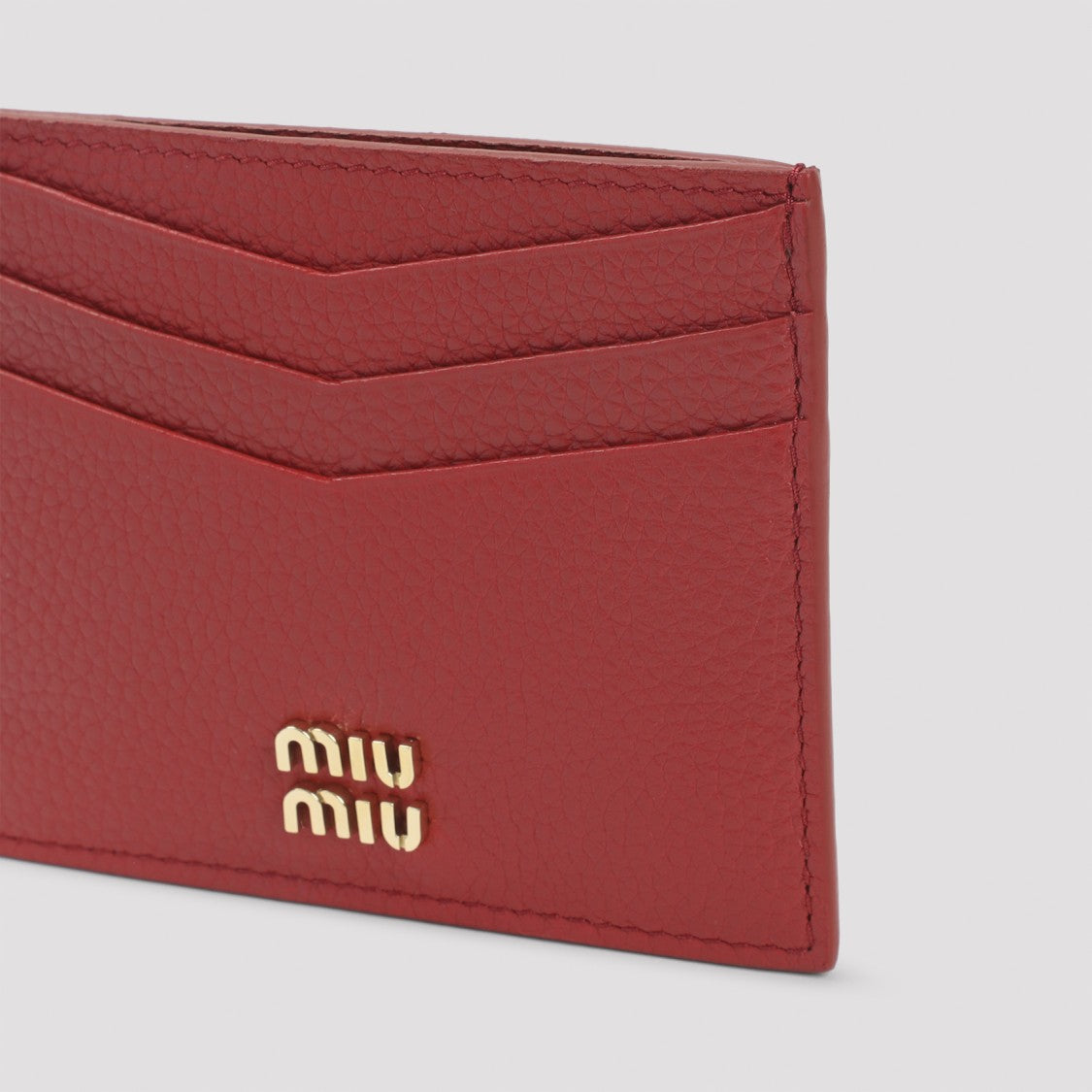 Miu Miu Compact Textured Leather Wallet With Embossed Logo