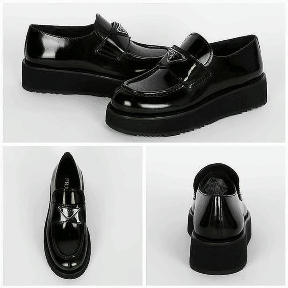 Prada Polished Leather Loafers With Triangular Metal Logo