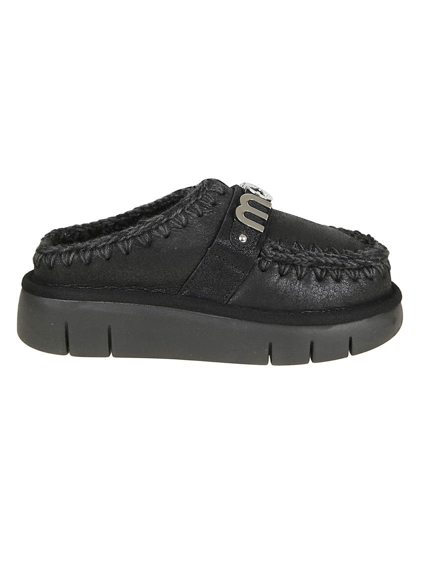Mou Moccasin-Inspired Black Slip-On Ankle Boots With Whipstitch Detailing