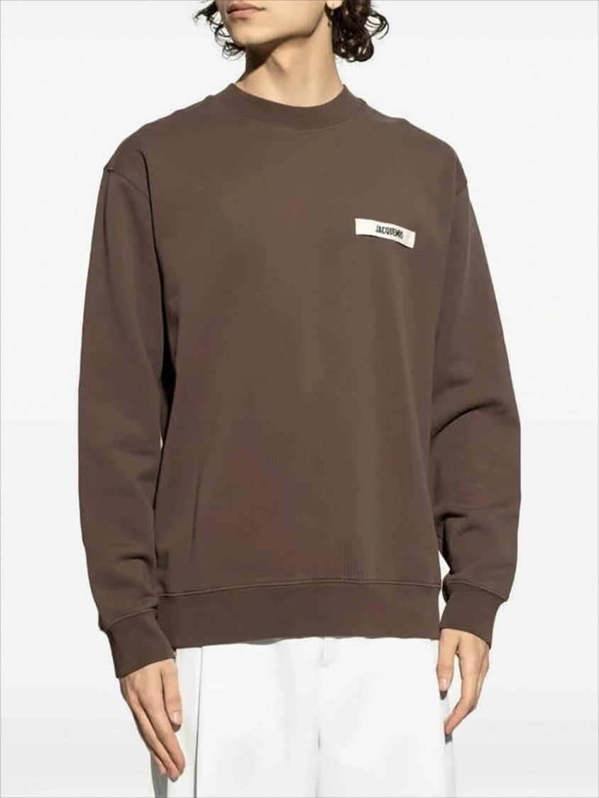 Jacquemus Long-Sleeve Relaxed Fit Cotton Sweatshirt With Text Patch