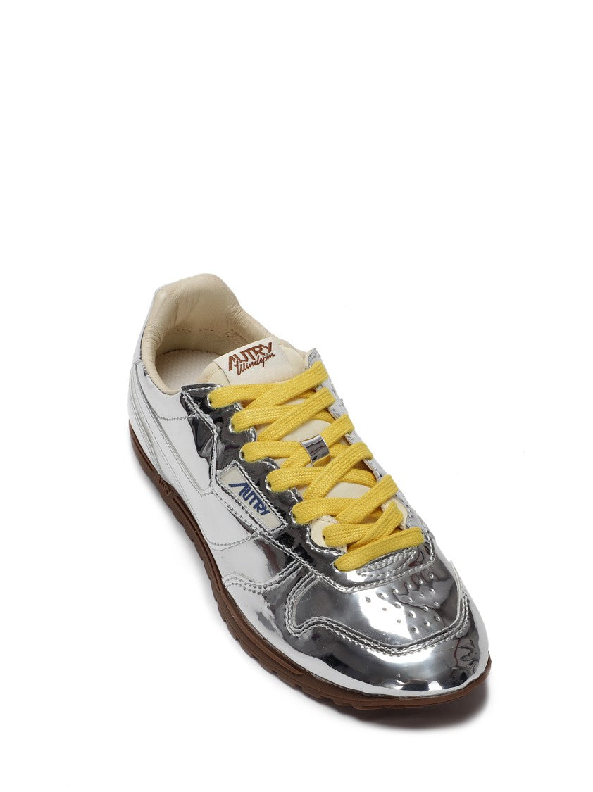 Autry Front Lace Sneakers In Bright Yellow And Shiny Silver
