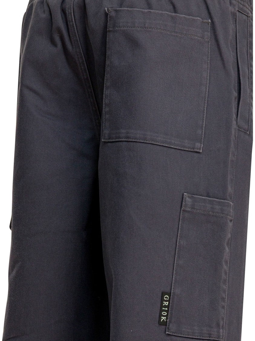 Gr10k Mid-Rise Cargo Pants With Reinforced Knees And Versatile Storage