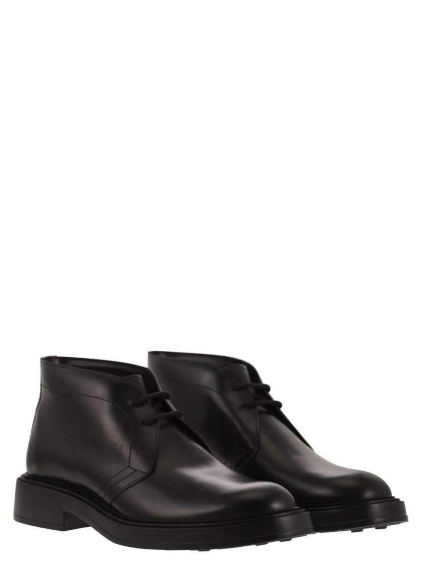 Tod's Calfskin Ankle Boots With Embossed Monogram