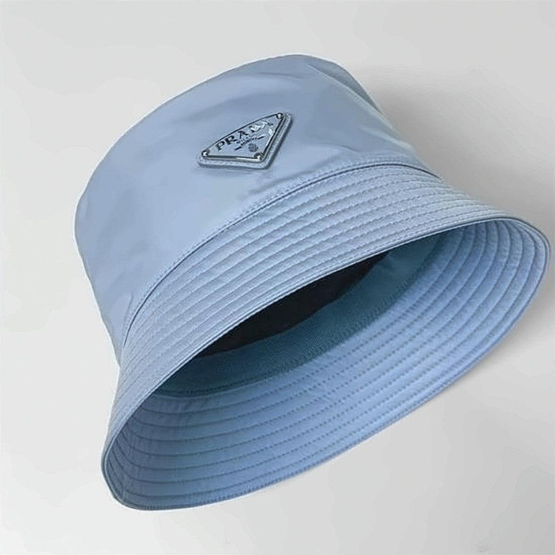 Prada Nylon Bucket Hat With Triangular Logo Plaque