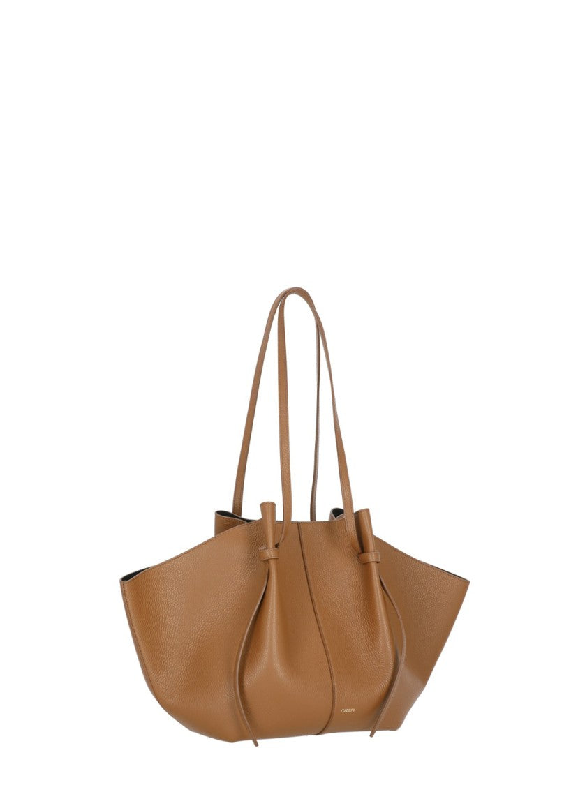 Yuzefi Winged Pebbled Leather Tote With Golden Logo