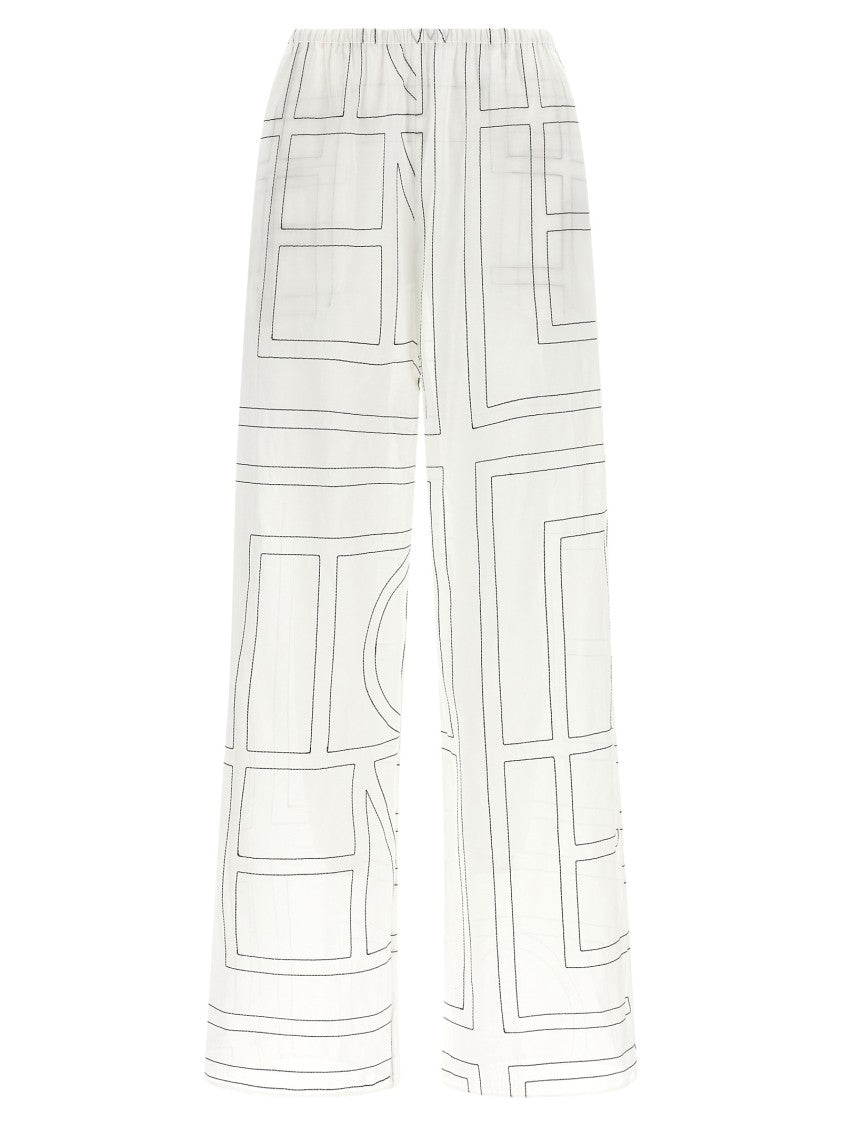 Totême Wide Leg Pajama-Style Pants With Monogram Embroidery