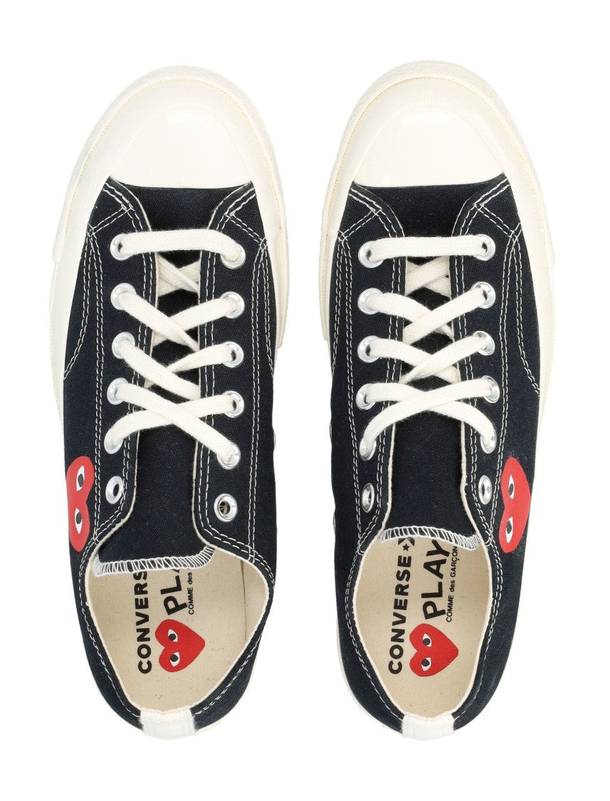 Comme Des Garçons X Converse Iconic Canvas Sneakers With Distinctive Heart Design
