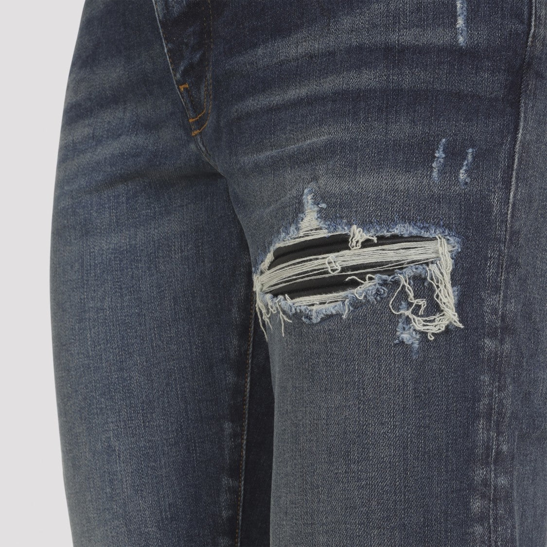 Amiri Distressed Blue Jeans With Edgy Ripped Details