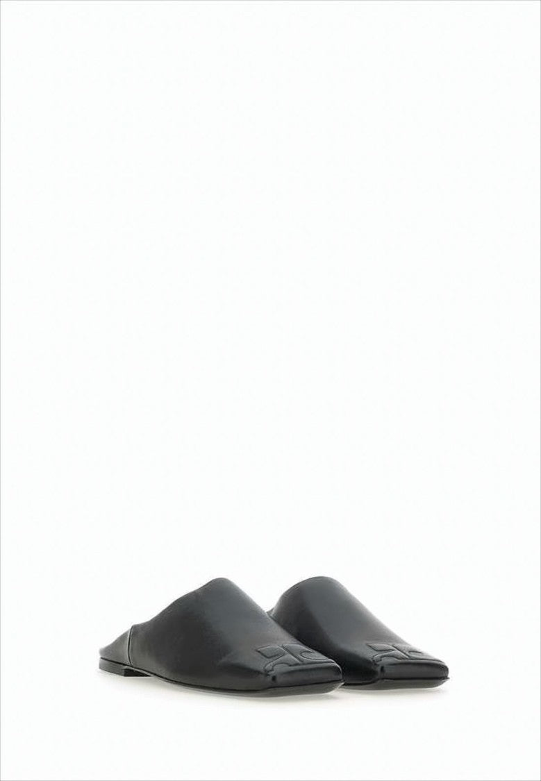 Courrèges Minimalist Black Lambskin Slip-On Mules With Embossed Detail