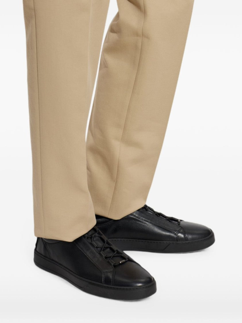 Tod's Minimalist Black Leather Sneakers With Textured Heel Detail