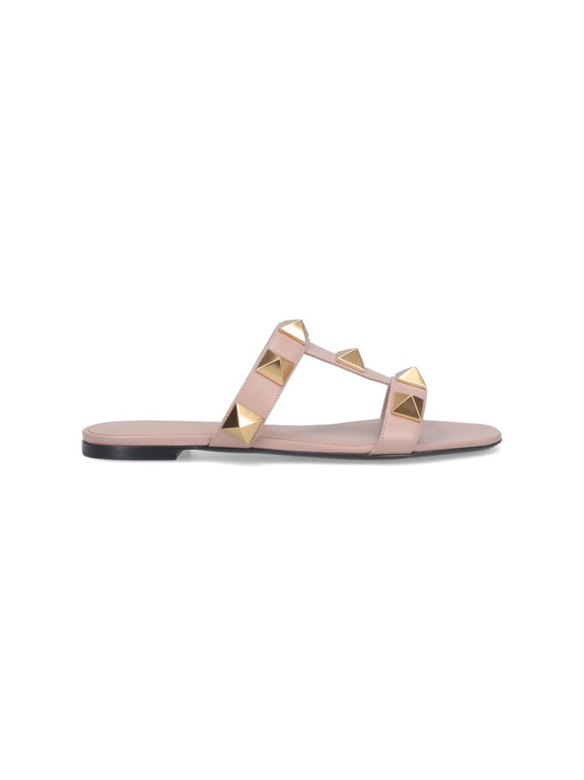 Valentino Garavani Minimalist Pink Flat Sandals With Pyramid Gold Studs