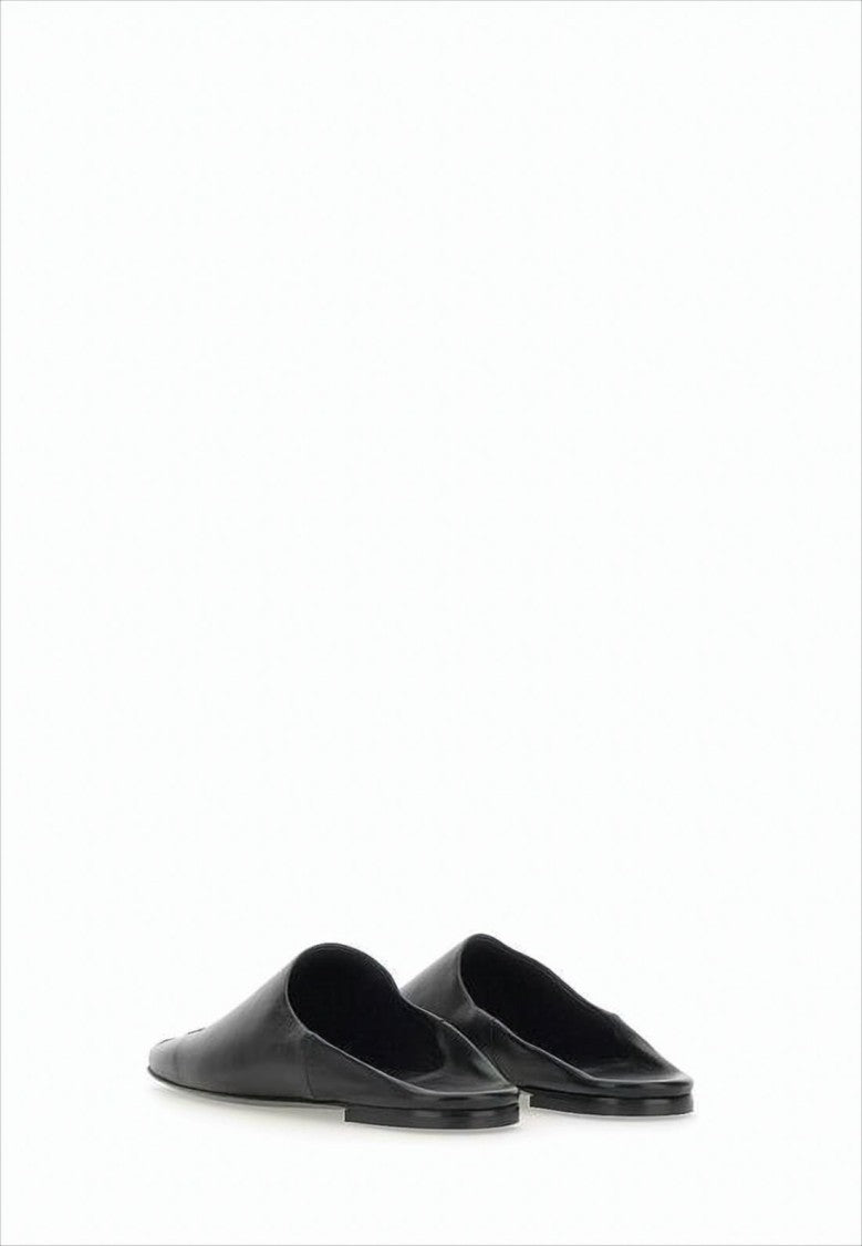 Courrèges Minimalist Black Lambskin Slip-On Mules With Embossed Detail