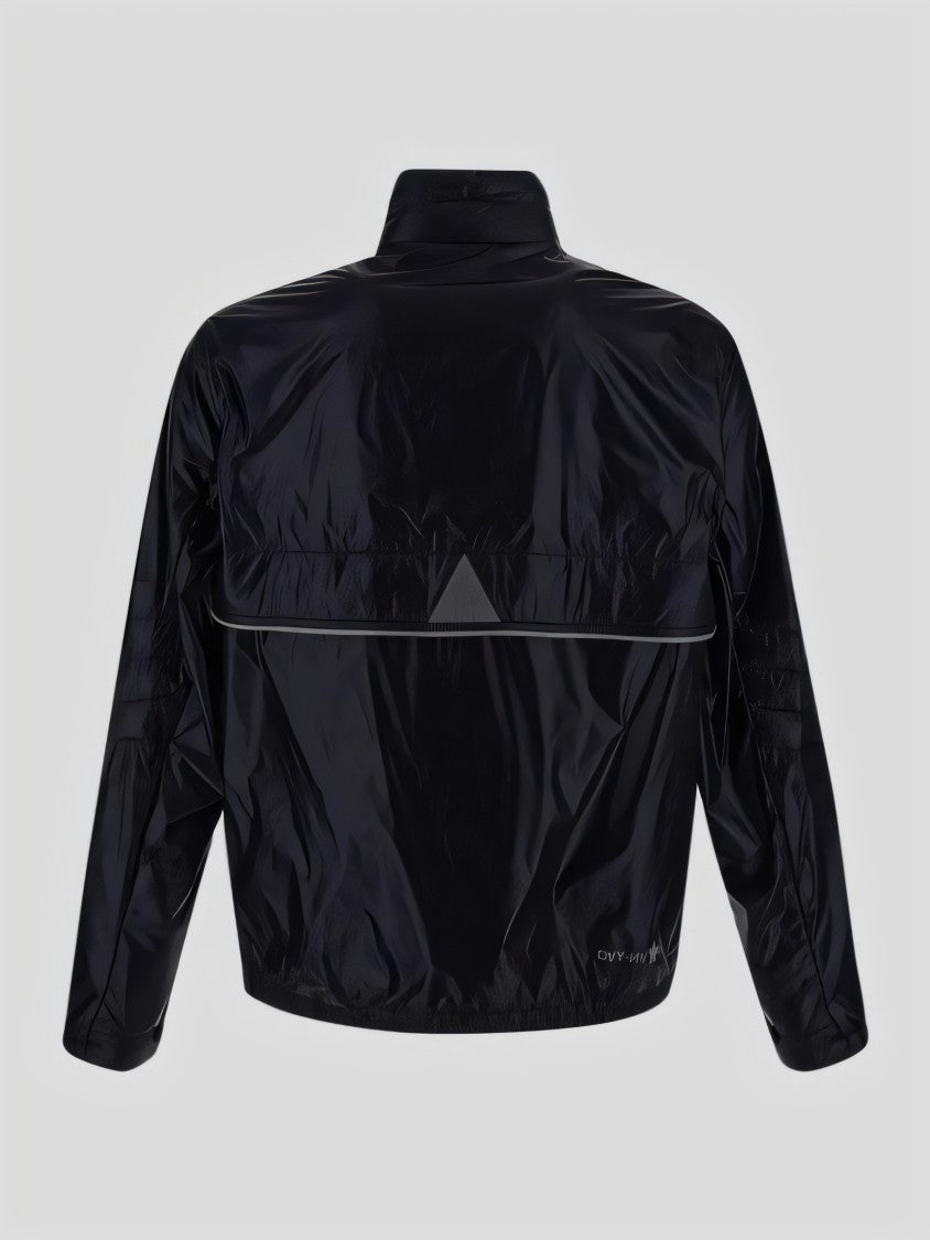 Moncler Quilted Down Jacket With High Collar And Zippered Pockets