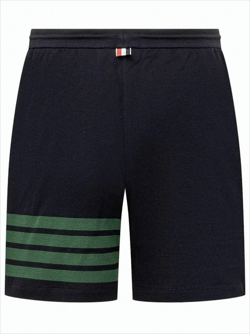 Thom Browne Tailored Black Shorts With Distinctive Green Stripe Detail