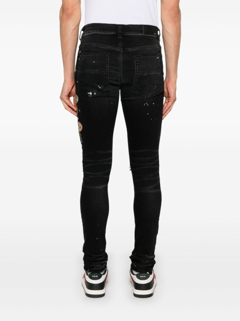 Amiri Slim Fit Black Distressed Jeans With Colorful Patches