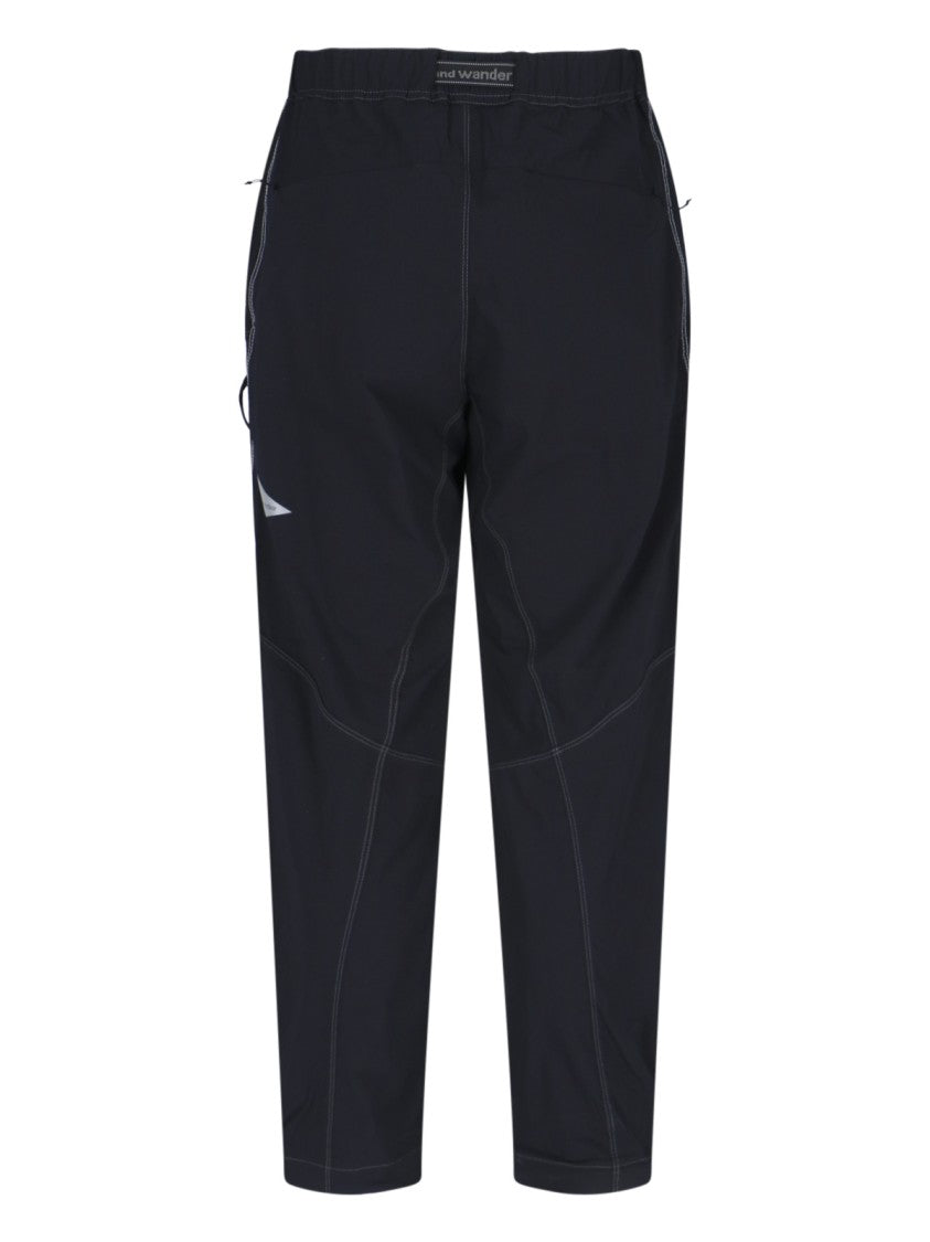 And Wander Streamlined Black Trousers With Zippered Pockets