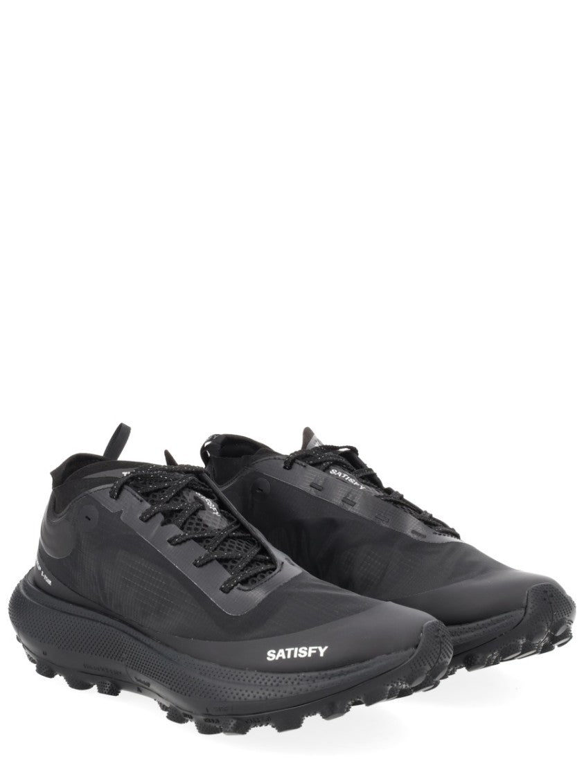 Satisfy Streamlined Black Sneakers With Rugged Tread And Textural Details