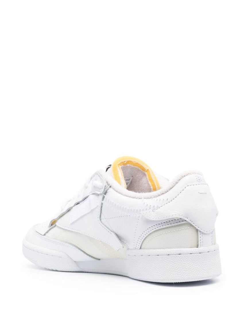 Maison Margiela Minimalist White Leather Low-Top Sneakers With Perforated Detailing