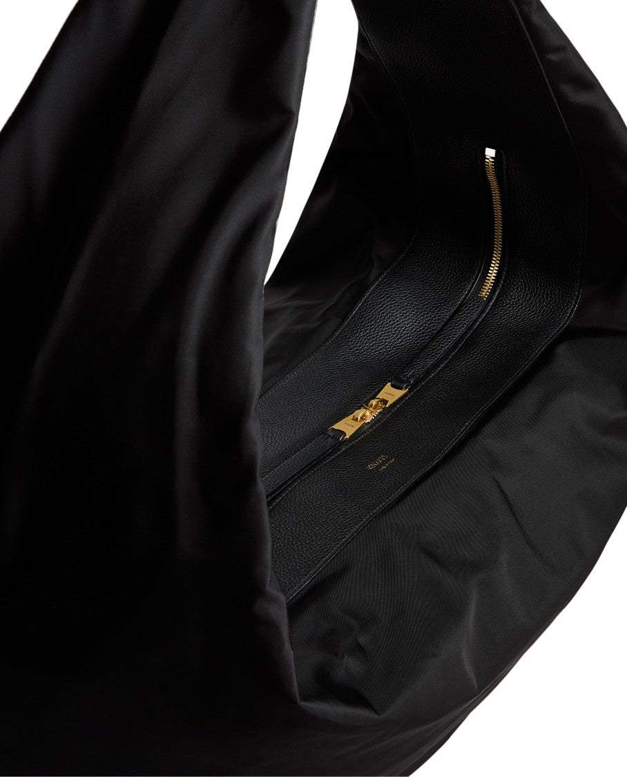 Khaite Crescent-Shaped Hobo Bag With Zip Closure And Gold Accents