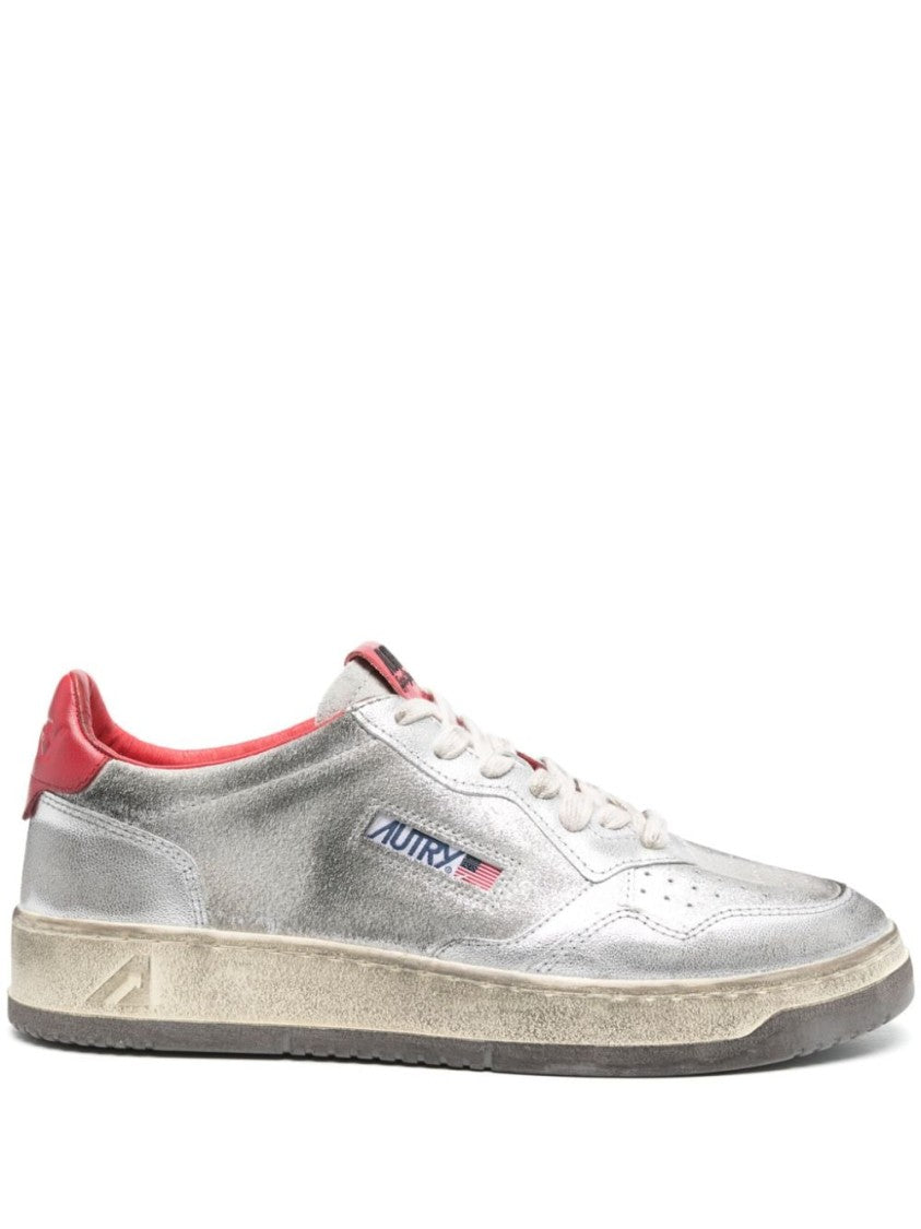 Autry Metallic Silver Sneakers With Textured Finish And Contrasting Red Accents