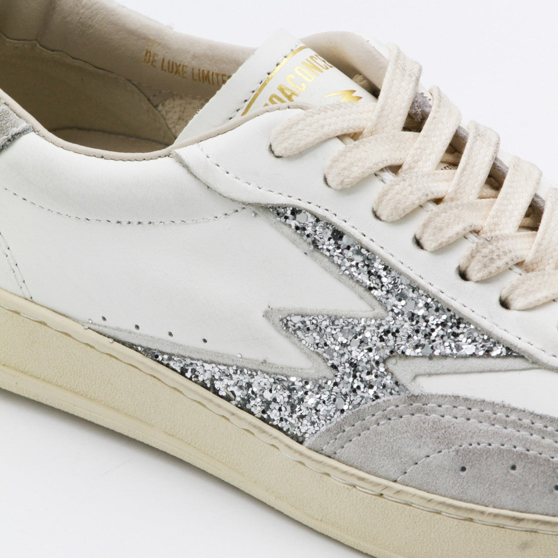 Moaconcept Low-Top White Leather Sneakers With Silver Lightning Bolt