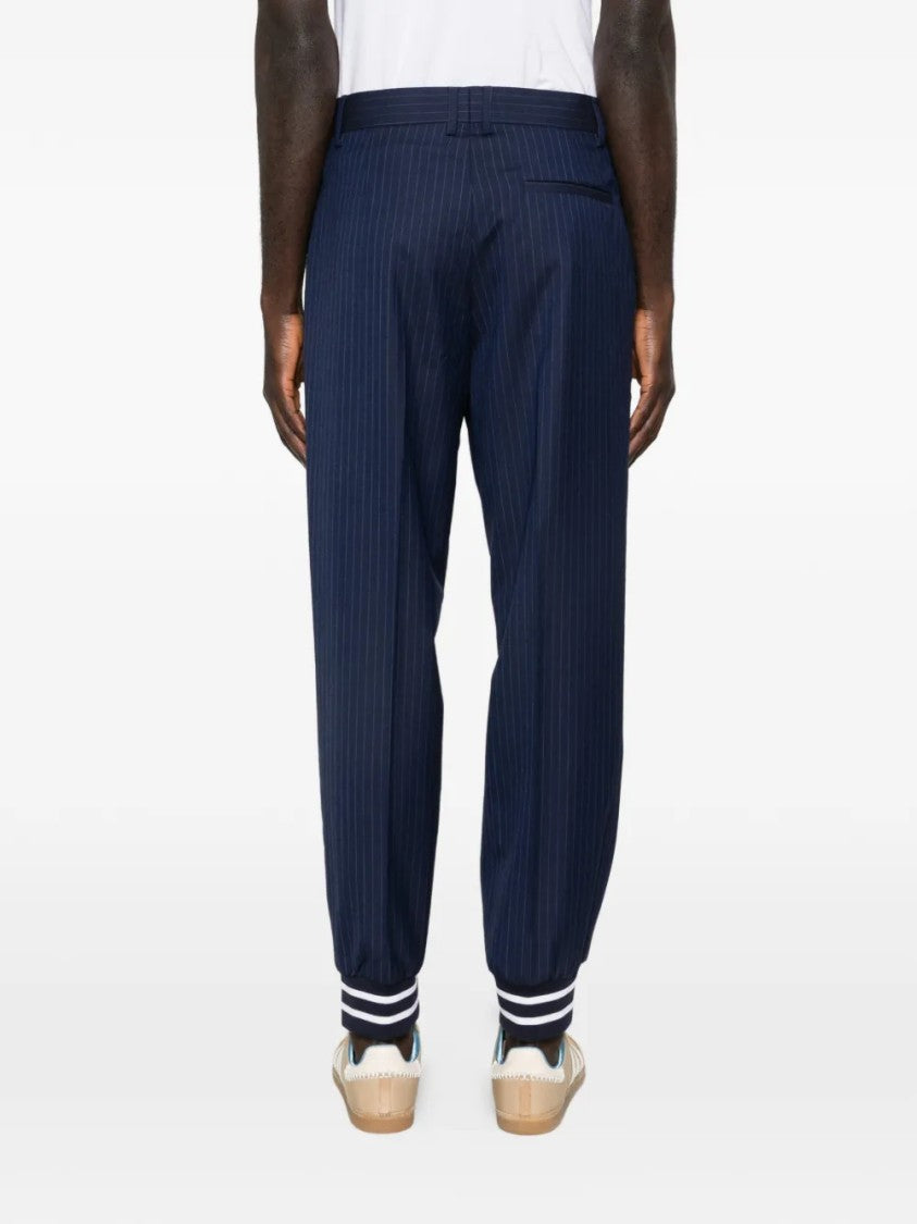 Moschino Relaxed Tapered Pants With Pinstripe Design And Elasticated Cuffs