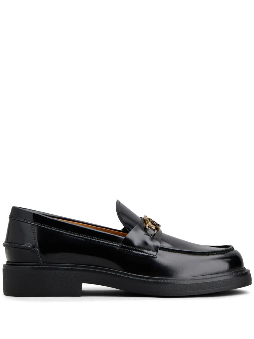 Tod's Glossy Black Leather Loafers With Decorative Emblem
