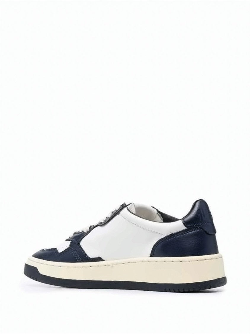 Autry Low-Top Leather Sneakers With Navy Overlays And Perforated Details